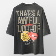 Black t-shirt with graphic design and text on a light gray background