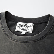Black t-shirt with a visible brand label on a gray background