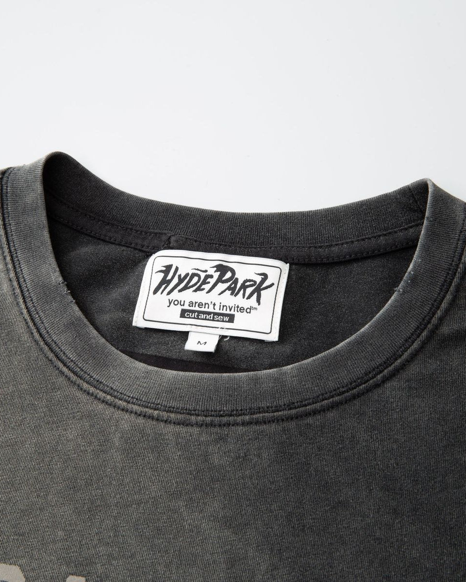 Black t-shirt with a visible brand label on a gray background