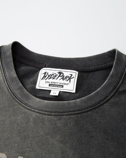 Black t-shirt with a visible brand label on a gray background