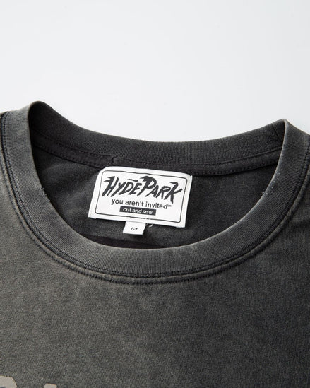 Black t-shirt with a visible brand label on a gray background
