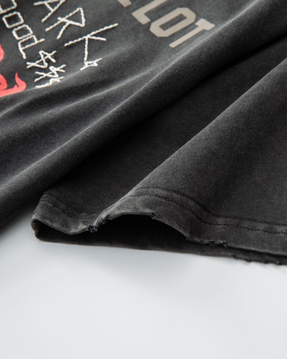 Black t-shirt with text and graphics on a white background