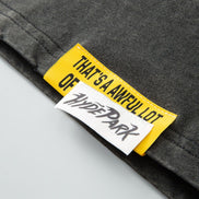 Close-up of a label on a garment with text and branding.