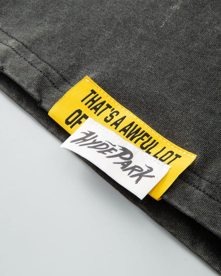 Close-up of a label on a garment with text and branding.