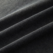 Close-up of dark gray fabric with folds
