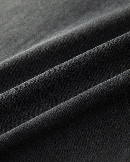 Close-up of dark gray fabric with folds