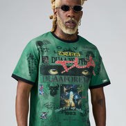 Man wearing a green t-shirt with graphic designs and text