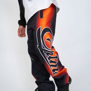 Black pants with orange and white design on a white background