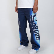 Person wearing blue pants with a logo on a white background