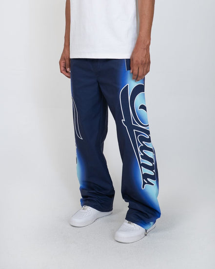 Person wearing blue pants with a logo on a white background