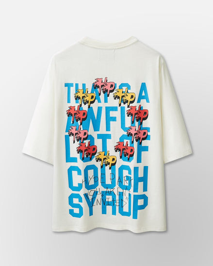 White t-shirt with colorful text design on a light gray background