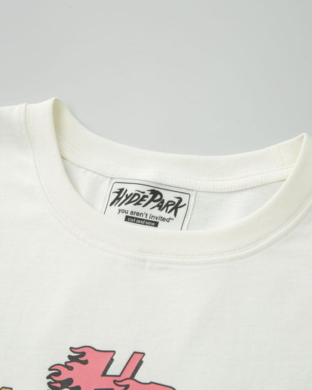 Close-up of a white t-shirt with a brand label on a gray background