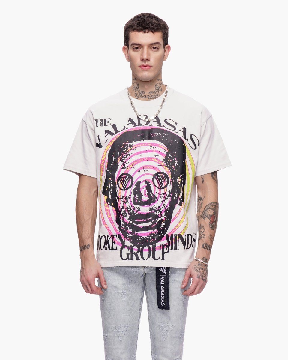 Person wearing a white t-shirt with graphic design and text on a white background