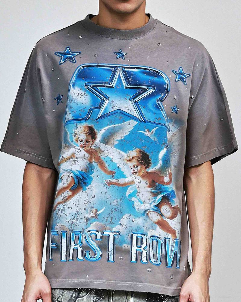 Person wearing a gray t-shirt with angel design and 'First Row' text on a plain background