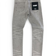 Gray jeans with a brand label on a white background