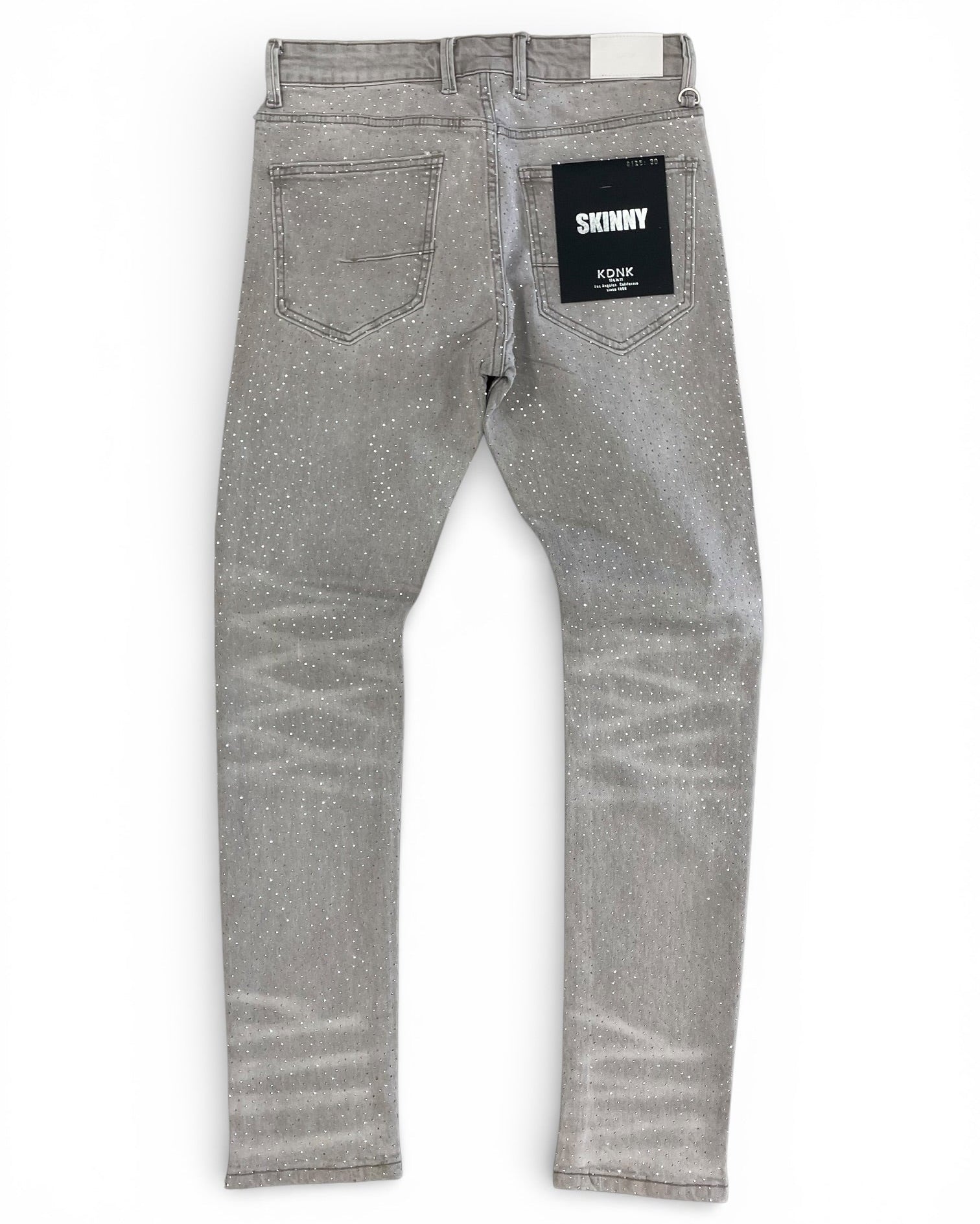 Gray jeans with a brand label on a white background