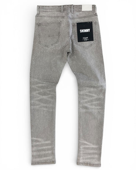 Gray jeans with a brand label on a white background