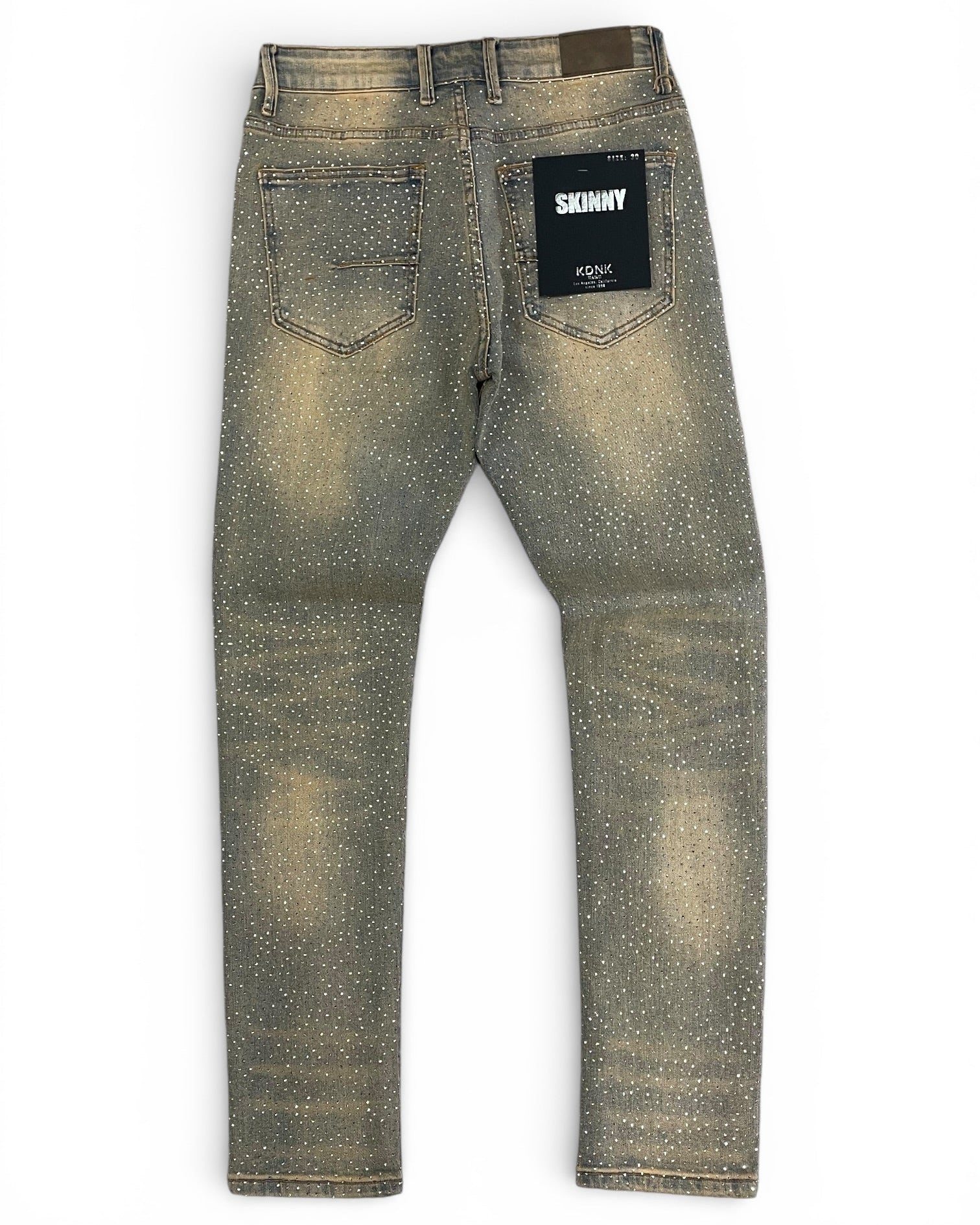 Skinnny jeans with a brand label on a white background