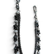 A black and silver beaded chain strap with star and textured bead details, shown on a plain white background.