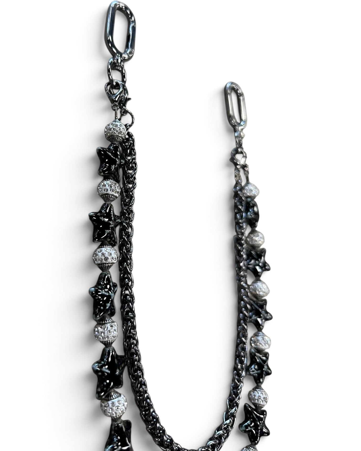 A black and silver beaded chain strap with star and textured bead details, shown on a plain white background.