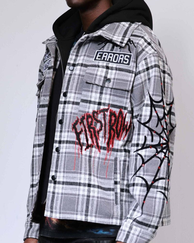 Plaid jacket with graphic designs and text on a plain background