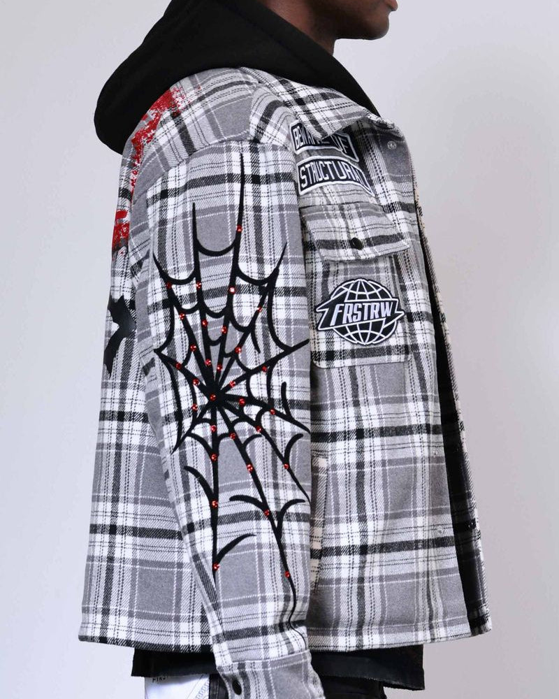 Plaid jacket with graphic designs on a plain background