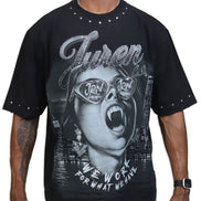 Person wearing a black t-shirt with graphic design and text
