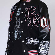 Black varsity jacket with white and red designs on a plain background