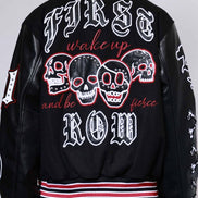 Black jacket with skull designs and text on a plain background