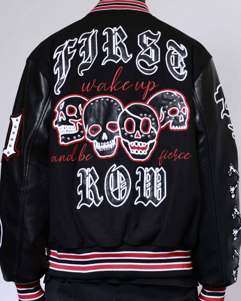 Black jacket with skull designs and text on a plain background