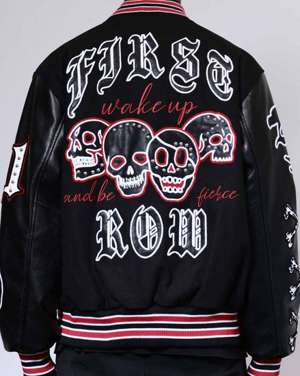 Black jacket with skull designs and text on a plain background