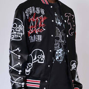 Black varsity jacket with skull and bone designs on a plain background