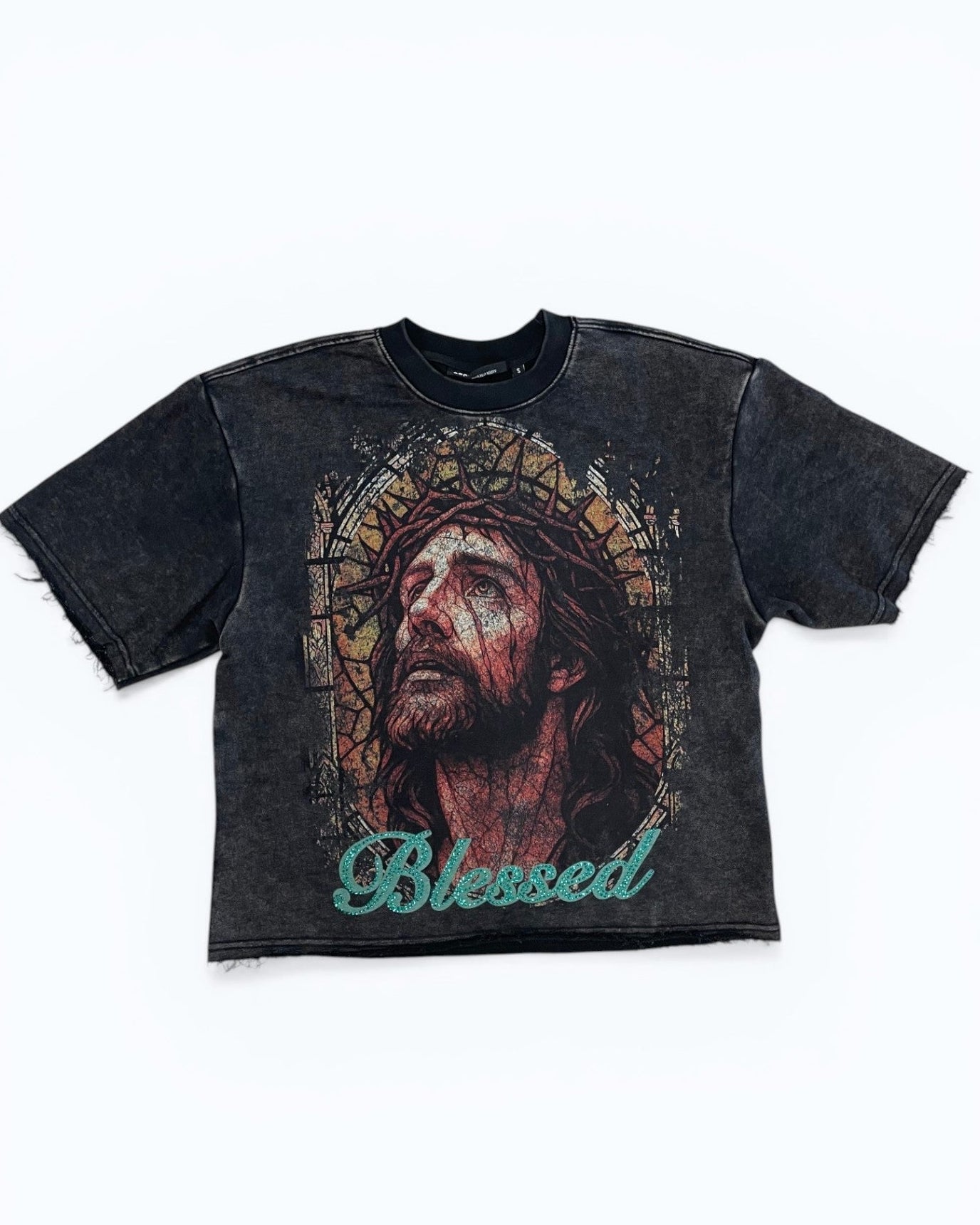 Black t-shirt with a graphic of a face and 'Blessed' text on a white background