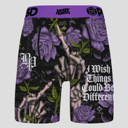 Shorts with purple roses, bones, and text on a black background with 'Broken Promises' branding.