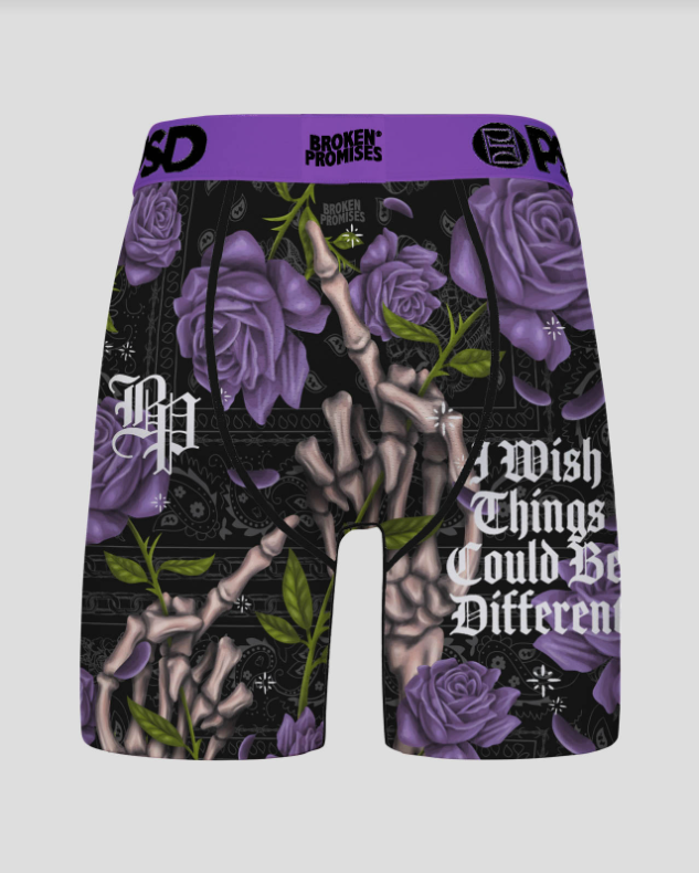 Shorts with purple roses, bones, and text on a black background with 'Broken Promises' branding.