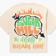 Beige t-shirt with 'Sugar Hill' and 'The Antidote to Brain Rot' text design on a white background