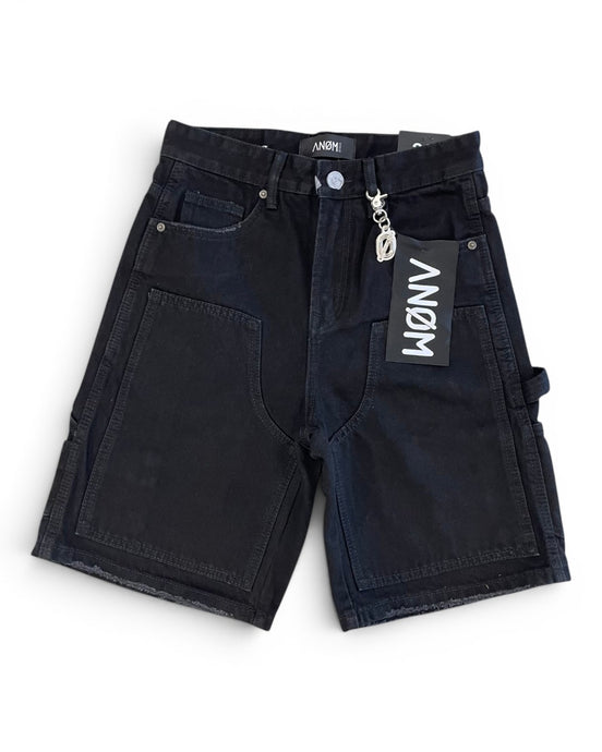 Black shorts with a brand tag on a white background