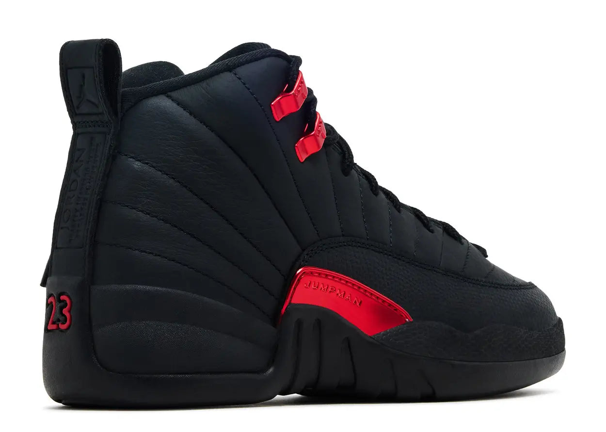 Black sneaker with red accents on a white background