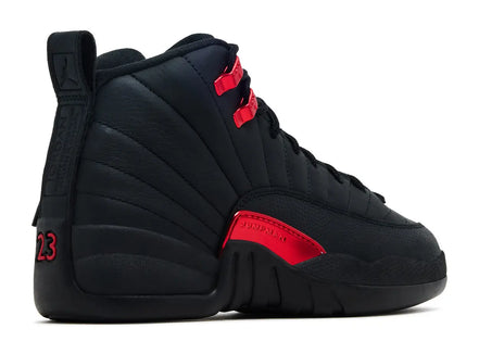 Black sneaker with red accents on a white background