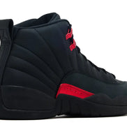 Black high-top sneaker with red accents on a white background