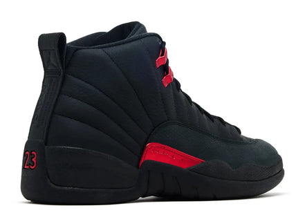 Black high-top sneaker with red accents on a white background