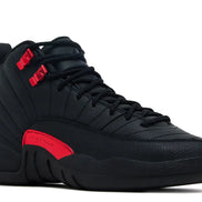 Black high-top sneaker with red accents on a white background