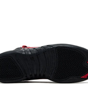 Black and red sneaker with a prominent brand logo on a white background