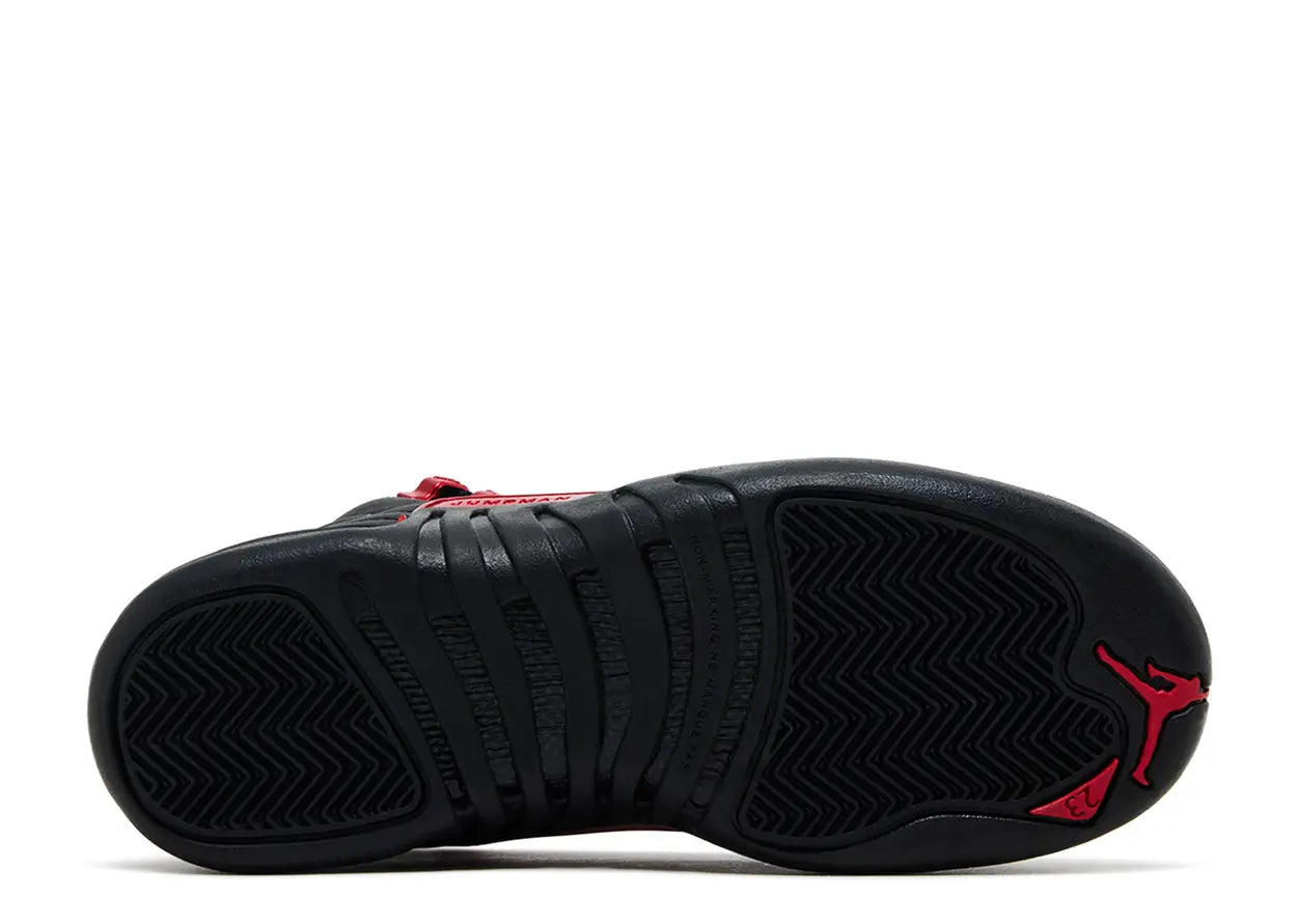 Black and red sneaker with a prominent brand logo on a white background