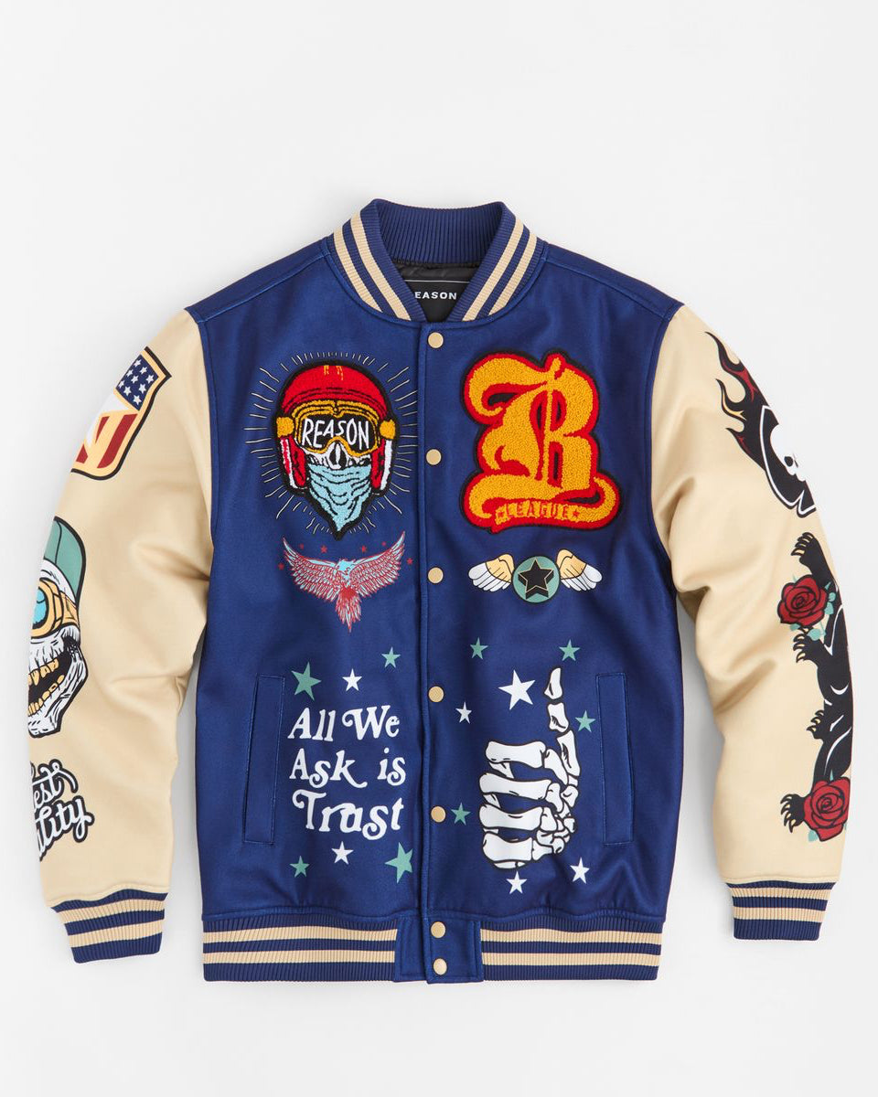 Blue and beige varsity jacket with various designs and text on a white background