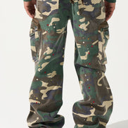 Camouflage pants worn by a person on a white background