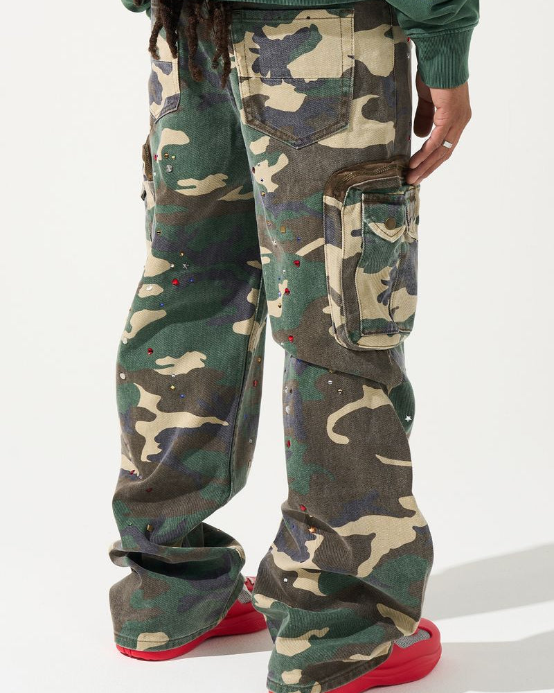 Camouflage pants worn by a person on a white background