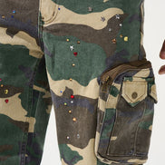 Camouflage pants with decorative elements on a white background