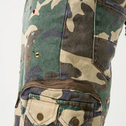 Camouflage pants with multiple pockets and zippers on a white background