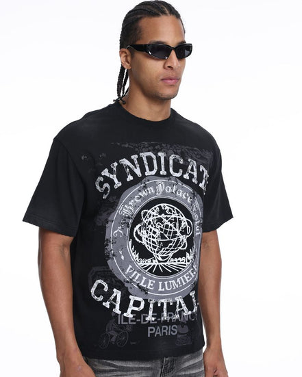 Man wearing a black t-shirt with 'Syndicate Capital' design on a white background